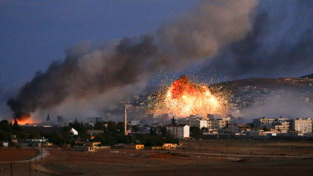 Smoke and flames rise over Syrian town of Kobani after an airstrike Smoke and flames rise over Syrian town of Kobani after an airstrike, as seen from the Mursitpinar crossing on the Turkish-Syrian border in the southeastern town of Suruc in Sanliurfa province, October 20, 2014. The United States told Turkey that a U.S. military air-drop of arms to Syrian Kurds battling Islamic State near the Syrian town of Kobani was a response to a crisis situation and did not represent a change in U.S. policy, U.S. Secretary of State John Kerry said on Monday. REUTERS/Kai Pfaffenbach