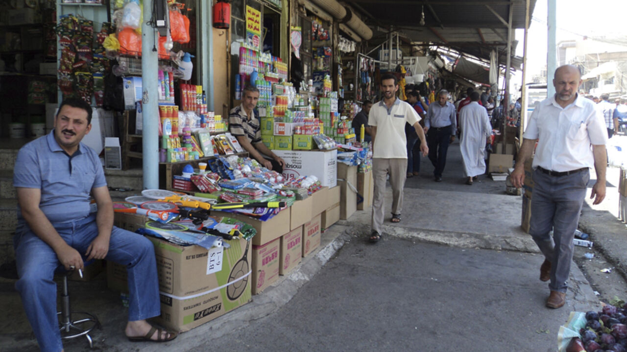 Residents shop at a market in the city of Mosul Residents shop at a market in the city of Mosul June 17, 2014. The United States is contemplating talks with its arch-enemy Iran to support the Iraqi government in its battle with Sunni Islamist insurgents who routed Baghdad's army and seized the north of the country in the past week. Picture taken June 17, 2014. REUTERS/Stringer (IRAQ - Tags: CIVIL UNREST POLITICS SOCIETY TPX IMAGES OF THE DAY) - RTR3UL3P