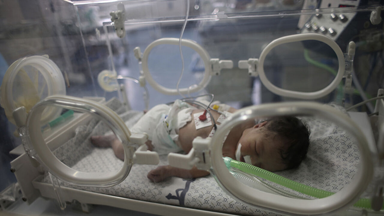 Palestinian baby girl Eid lies in an incubator after doctors delivered her from the womb of her mother, whom medics said was killed in an Israeli air strike, at a hospital in Khan Younis in the southern Gaza Strip Palestinian baby girl Shayma Shiekh al-Eid lies in an incubator after doctors delivered her from the womb of her mother, whom medics said was killed in an Israeli air strike, at a hospital in Khan Younis in the southern Gaza Strip July 27, 2014. REUTERS/Ibraheem Abu Mustafa (GAZA - Tags: POLITICS CIVIL UNREST HEALTH TPX IMAGES OF THE DAY) - RTR409X4