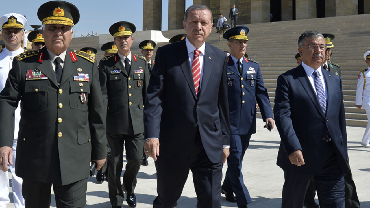 Turkey's PM Erdogan leaves after wreath-laying ceremony with members of the High Military Council at Anitkabir, mausoleum of modern Turkey's founder Mustafa Kemal Ataturk, in Ankara Turkey's Prime Minister Tayyip Erdogan (C), flanked by Chief of Staff General Necdet Ozel (L) and Defence Minister Ismet Yilmaz (R), leaves after a wreath-laying ceremony with members of the High Military Council at Anitkabir, the mausoleum of modern Turkey's founder Mustafa Kemal Ataturk, ahead of a High Military Council meeting in Ankara August 4, 2014. REUTERS/Stringer (TURKEY - Tags: POLITICS MILITARY ANNIVERSARY) - RTR415K3