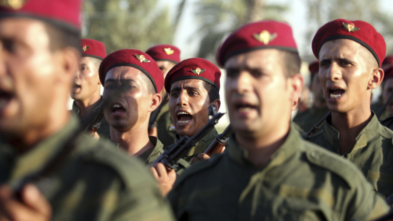Shi'ite volunteers, from Abbas Unit who have joined the Iraqi army to fight against militants of the Islamic State, parade down a street in Kerbala Shi'ite volunteers, from Abbas Unit who have joined the Iraqi army to fight against militants of the Islamic State, formerly known as the Islamic State in Iraq and the Levant (ISIL), parade down a street in Kerbala, southwest of Baghdad August 14, 2014. U.S. President Barack Obama said on Thursday that the Islamist militant siege of Iraq's Mount Sinjar had been broken and most of the U.S. military personnel sent to assess the situation would be pulled out of Iraq in the coming days. REUTERS/Mushtaq Muhamme