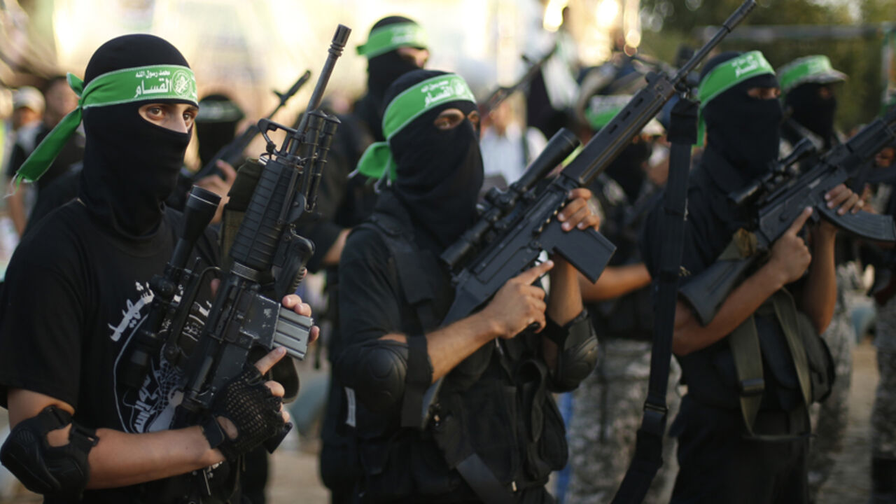 Hamas militants march during a rally in memory of people who were killed during a seven-week Israeli offensive, in Gaza City Hamas militants march during a rally in memory of people who were killed during a seven-week Israeli offensive, in Gaza City September 26, 2014. An open-ended ceasefire between Israel and Hamas-led Gaza militants, mediated by Egypt, took effect on August 26 after the seven-week conflict. It called for an indefinite halt to hostilities, the immediate opening of Gaza's blockaded crossings with Israel and Egypt, and a widening of the territory's fishing zone in the Mediterranean. REUTERS/Suhaib Salem (GAZA - T