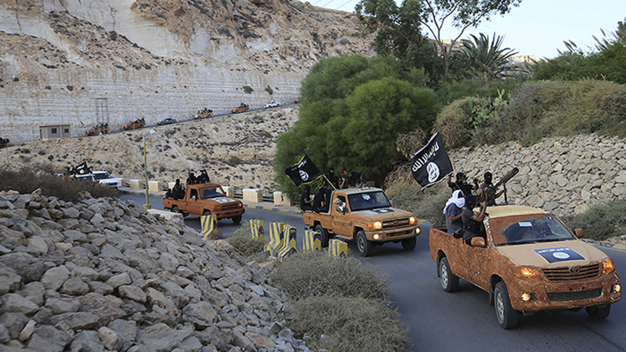 An armed motorcade belonging to members of Derna's Islamic Youth Council, consisting of former members of militias from the town of Derna, drive along a road in Derna, eastern Libya An armed motorcade belonging to members of Derna's Islamic Youth Council, consisting of former members of militias from the town of Derna, drive along a road in Derna, eastern Libya October 3, 2014. The group pledged allegiance to the Islamic State on October 3, 2014 local media reported. Picture taken October 3, 2014. REUTERS/Stringer (LIBYA - Tags: POLITICS CIVIL UNREST CONFLICT TPX IMAGES OF THE DAY) - RTR49BS8