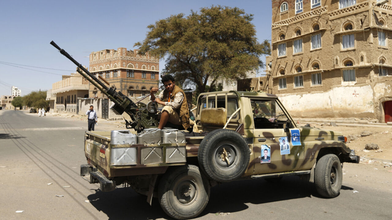 Follower of the Shi'ite Houthi movement mans a machine gun mounted on military pick up in Sanaa A follower of the Shi'ite Houthi movement mans a machine gun mounted on a military pick up in Sanaa October 20, 2014. The truck was taken by the movement's fighters during recent clashes with army soldiers in Sanaa. REUTERS/Khaled Abdullah (YEMEN - Tags: POLITICS CIVIL UNREST MILITARY) - RTR4AU1L