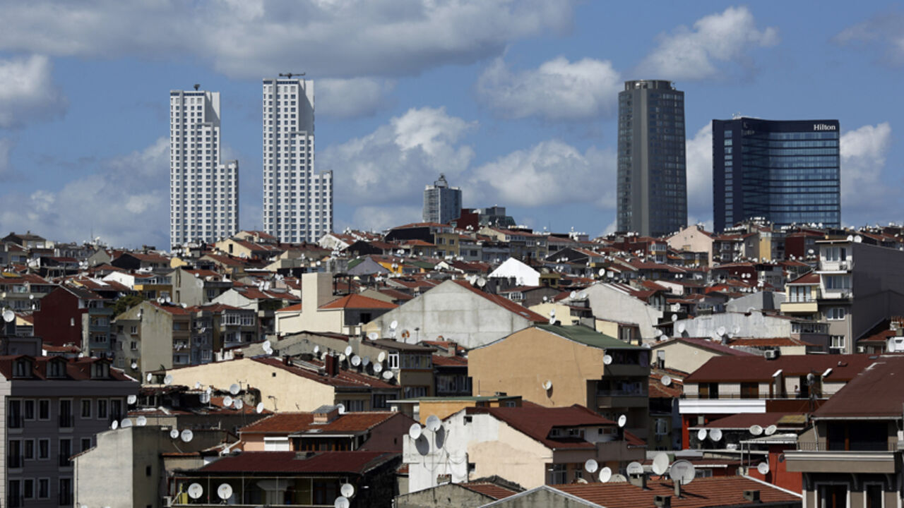 Skyscrapers are pictured behind old buildings in Beyoglu district in central Istanbul Skyscrapers are pictured behind old buildings in Beyoglu district in central Istanbul August 29, 2014. The Turkish Parliament amended the commercial code to allow landlords to eject tenants of 10 years or more without cause. The rule, which went into effect in July, scraps a tradition of renter-friendly laws, potentially hitting millions of businesses and residents. Picture taken August 29, 2014. To match TURKEY-GENTRIFICATION/ REUTERS/Murad Sezer (TURKEY - Tags: BUSINESS SOCIETY POLITICS CITYSCAPE) - RTR4B