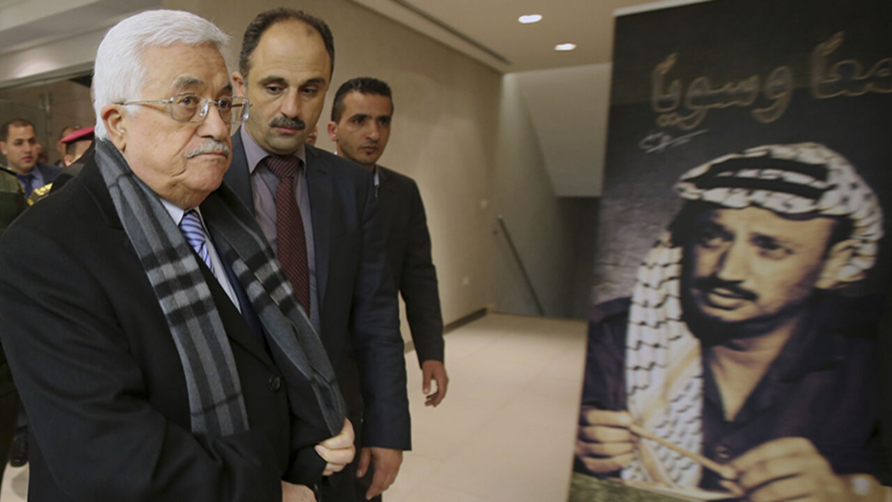 Palestinian President Mahmoud Abbas arrives for the opening of a museum of late Palestinian leader Yasser Arafat in the West Bank city of Ramallah Palestinian President Mahmoud Abbas (C) arrives for the opening of a museum of late Palestinian leader Yasser Arafat in the West Bank city of Ramallah, November 9, 2014. REUTERS/Abbas Momani/Pool (WEST BANK - Tags: POLITICS SOCIETY) - RTR4DGQA