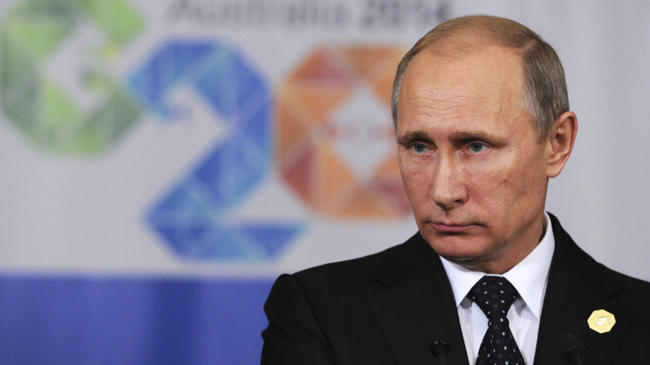 Russia's President Vladimir Putin attends a news conference at the end of the G20 summit in Brisbane November 16, 2014. Putin said on Sunday that there is a "good chance of resolution" in the Ukraine conflict, contradicting Western concerns over an escalation in fighting in the southeast of the country. REUTERS/Mikhail Klimentyev/RIA Novosti/Kremlin (RUSSIA - Tags: POLITICS HEADSHOT PROFILE) THIS IMAGE HAS BEEN SUPPLIED BY A THIRD PARTY. IT IS DISTRIBUTED, EXACTLY AS RECEIVED BY REUTERS, AS A SERVICE TO CLI