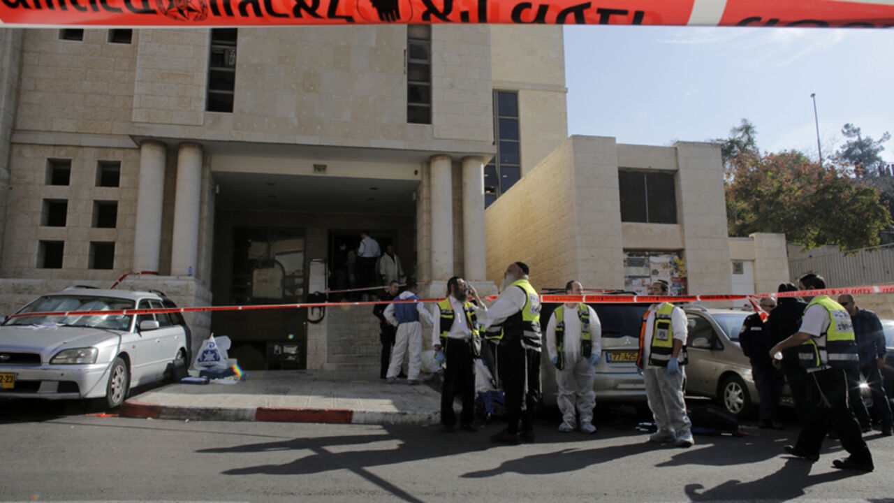 Members of the Israeli Zaka emergency response team stand at the scene of an attack at a Jerusalem synagogue Members of the Israeli Zaka emergency response team stand at the scene of an attack at a Jerusalem synagogue November 18, 2014. Two suspected Palestinian men armed with axes and knives killed four people in a Jerusalem synagogue on Tuesday before being shot dead by police, Israeli police and emergency services said, the deadliest such attack in the city in years. REUTERS/Ammar Awad (JERUSALEM - Tags: CIVIL UNREST POLITICS RELIGION) - RTR4EJEF