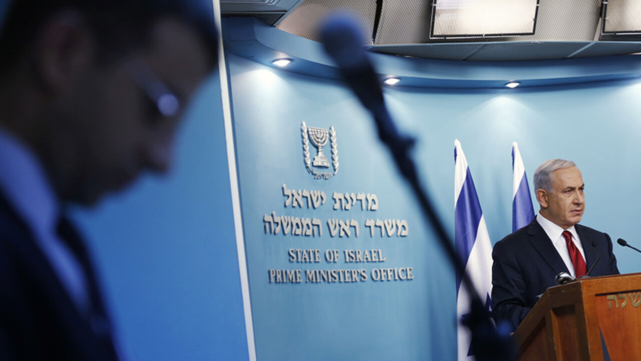 Israel's Prime Minister Benjamin Netanyahu delivers a statement to the media in Jerusalem November 18, 2014. Two Palestinians armed with a meat cleaver and a gun killed four worshippers in a Jerusalem synagogue on Tuesday before being shot dead by police, the deadliest such incident in six years in the holy city. Israeli Prime Minister Benjamin Netanyahu pledged to respond with a "heavy hand" and accused Western-backed Palestinian President Mahmoud Abbas of inciting violence in Jerusalem.  REUTERS/Baz Ratne