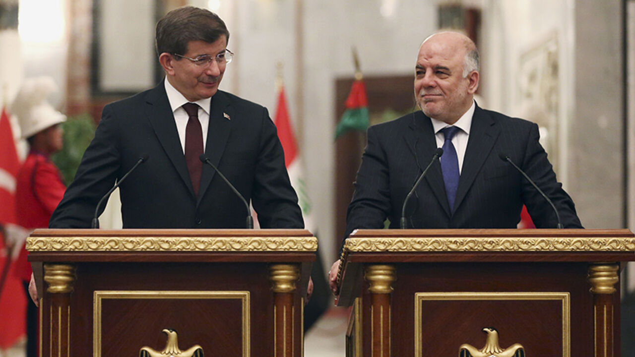 Iraqi prime Minister Haider al-Abadi speaks at a news conference with Turkey's Prime Minister Ahmet Davutoglu in Baghdad Iraqi prime Minister Haider al-Abadi (R) speaks at a news conference with Turkey's Prime Minister Ahmet Davutoglu in Baghdad, November 20, 2014. REUTERS/Hadi Mizban/Pool (IRAQ - Tags: POLITICS) - RTR4EWED