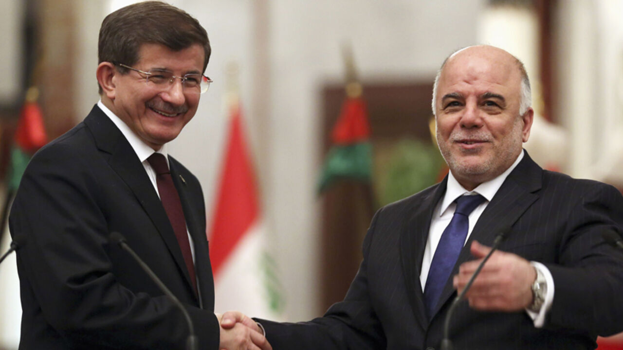 Iraqi Prime Minister Haider al-Abadi shakes hands with the Turkey's Prime Minister Ahmet Davutoglu in Baghdad Iraqi Prime Minister Haider al-Abadi (R) shakes hands with Turkey's Prime Minister Ahmet Davutoglu in Baghdad, November 20, 2014. REUTERS/Hadi Mizban/Pool (IRAQ - Tags: POLITICS) - RTR4EWHF