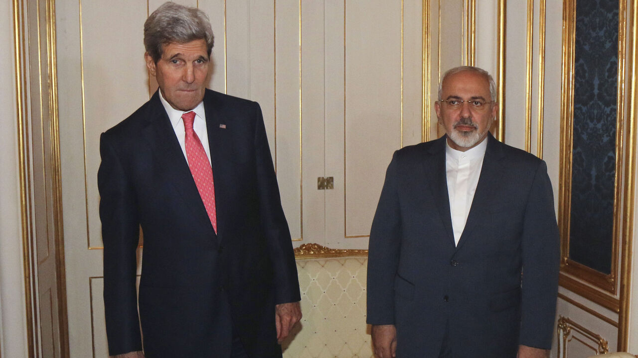 U.S. Secretary of State Kerry and Iranian FM Zarif before their meeting in Vienna U.S. Secretary of State John Kerry (L) and Iranian Foreign Minister Javad Zarif (R) are pictured before a meeting in Vienna November 23, 2014. Iran, the United States and other world powers are all but certain to miss Monday's deadline for negotiations to resolve a 12-year stand-off over Tehran's atomic ambitions, forcing them to seek an extension, sources say. The talks in Vienna could lead to a transformation of the Middle East, open the door to ending economic sanctions on Iran and start to bring a natio