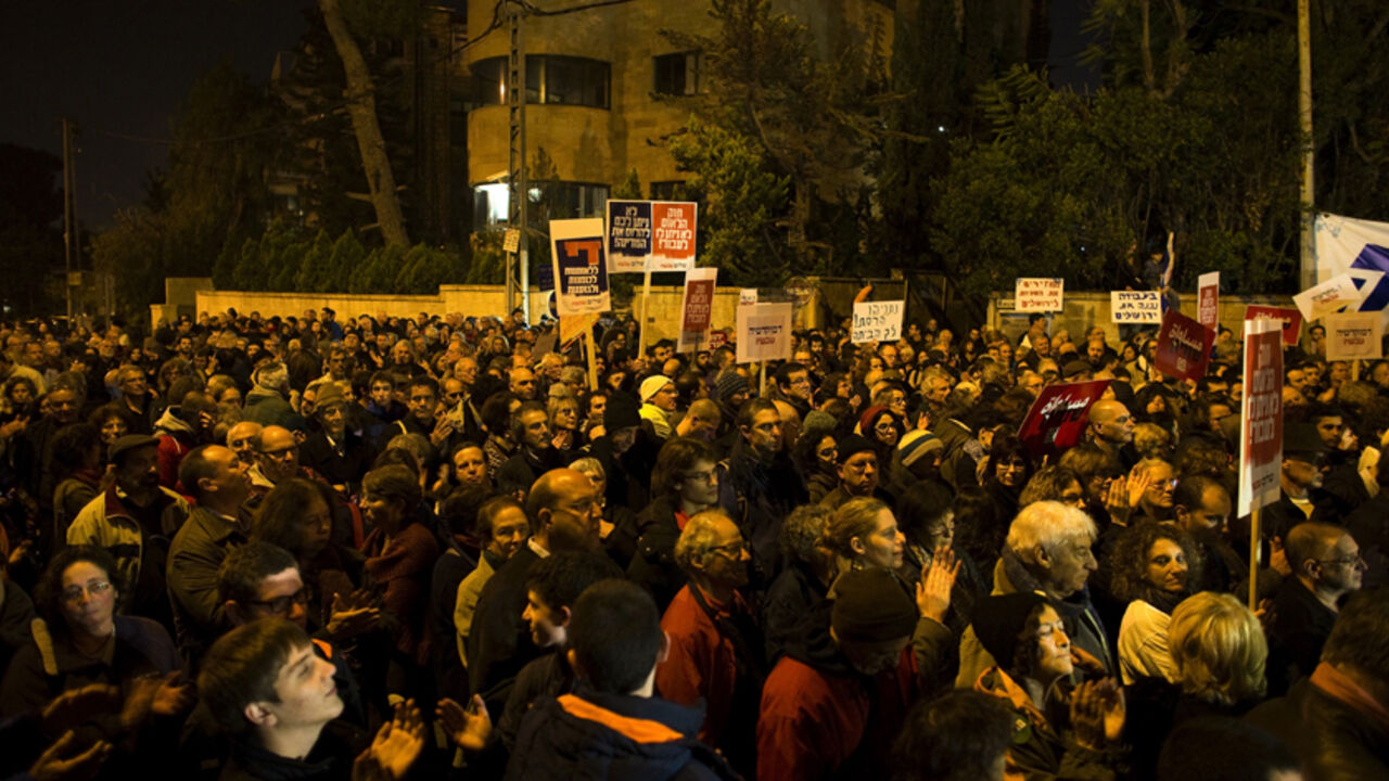 Israeli left-wing activists attend a rally against the contentious bill that would define Israel as the Jewish nation state and enshrine certain rights for Jews, in Jerusalem Israeli left-wing activists attend a rally against the contentious bill that would define Israel as the Jewish nation state and enshrine certain rights for Jews, in Jerusalem November 29, 2014. REUTERS/Ronen Zvulun (JERUSALEM - Tags: POLITICS CIVIL UNREST) - RTR4G2WN