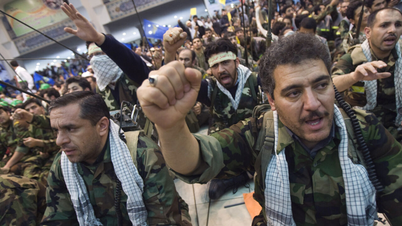 Members of Iran's Islamic Basij militia shout anti-U.S. and anti-Israel slogans during ceremony to mark Basij week in Tehran EDITORS' NOTE: Reuters and other foreign media are subject to Iranian restrictions on leaving the office to report, film or take pictures in Tehran.
Members of Iran's Islamic Basij militia shout anti-U.S. and anti-Israel slogans during a ceremony to mark Basij week in Tehran November 26, 2009. REUTERS/Morteza Nikoubazl (IRAN MILITARY POLITICS) - RTXR603