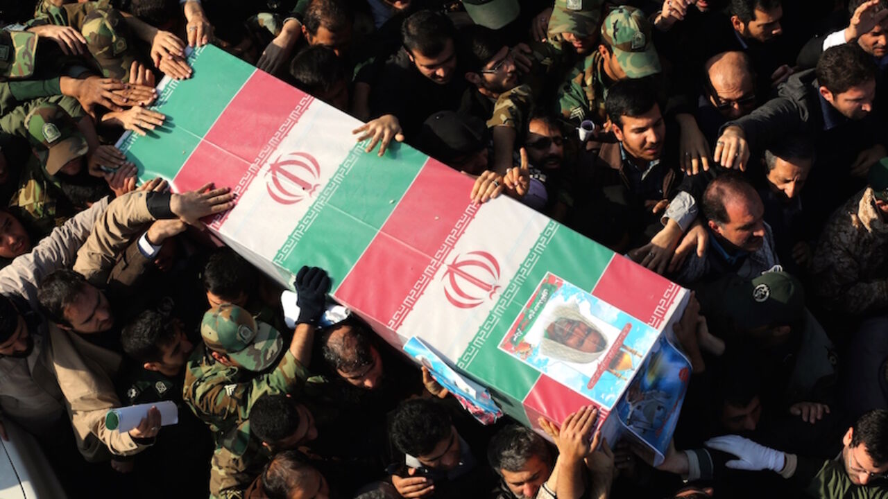 Nic6401547 Iranians carry the coffin of Brigadier General Hamid Taghavi, a commander of the Revolutionary Guards reportedly killed in the Iraqi city of Samarra, during his funeral in the capital Tehran on December 29, 2014. According to Iran's Revolutionary Guards, the senior military officer has been killed while advising Iraqi troops in their fight against the Islamic State group. AFP PHOTO / ATTA KENARE (Photo credit should read ATTA KENARE/AFP/Getty Images)