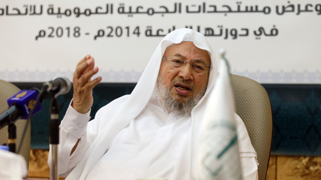 IRAQ-SECURITY/QARADAWI Chairman of the International Union of Muslim Scholars Youssef al-Qaradawi speaks during a news conference in Doha June 23, 2014. The influential Sunni Muslim cleric said on Monday that only dialogue could solve Iraq's crisis, sounding a conciliatory note on the threat posed by Sunni Islamist insurgents that could further polarise the Middle East along sectarian lines. Picture taken June 23. REUTERS/Mohammed Dabbous (QATAR - Tags: RELIGION POLITICS CIVIL UNREST) - RTR3VSK2