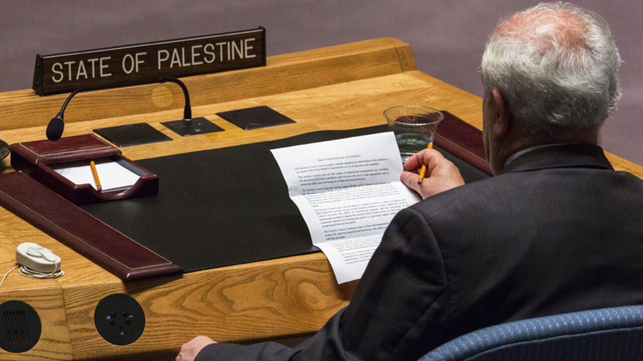 Palestinian U.N. Ambassador Riyad Mansour reads a statement from the President of the United Nations Security Council, Rwanda's U.N. Ambassador Eugene Gasana (not pictured) during a meeting at the U.N. headquarters in New York July 28, 2014. The U.N. Security Council agreed on a statement on Sunday urging Israel, Palestinians and Islamist Hamas militants to implement a humanitarian truce beyond the Muslim holiday of Eid al-Fitr and engage in efforts to achieve a durable ceasefire. REUTERS/Lucas Jackson (UNI