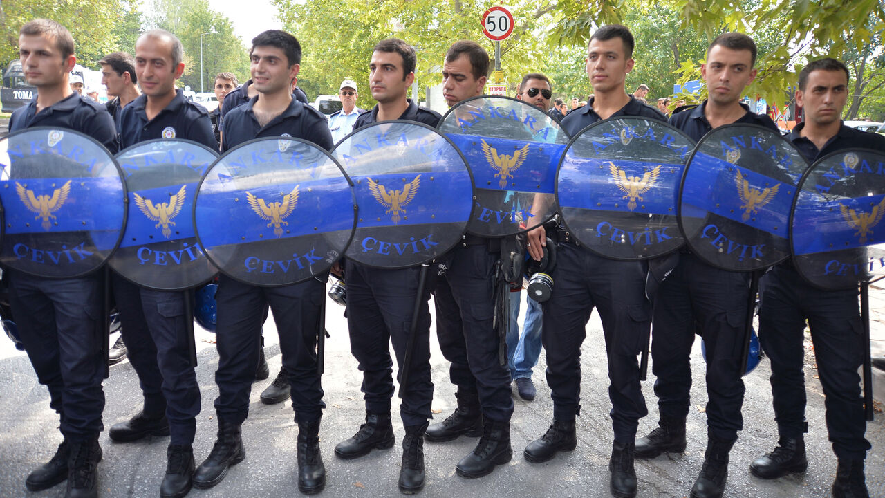 Riot police block a street leading to Presidential Palace of Cankaya as members of TGB protest against president-elect Erdogan in Ankara Riot police block a street leading to Presidential Palace of Cankaya as members of Turkish Youth Union (TGB) protest against president-elect Tayyip Erdogan in Ankara August 11, 2014. Erdogan began the process of picking his successor as prime minister on Monday, a figure he hopes will triumph in next year's general election and secure his goal of forging a powerful presidency.
REUTERS/Stringer (TURKEY - Tags: POLITICS ELECTIONS CIVIL UNREST) - RTR420KI