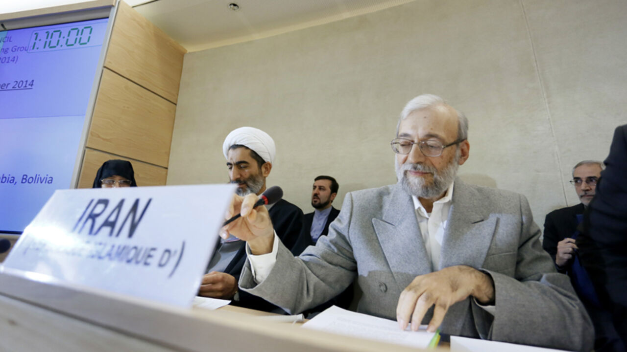 Larijani, secretary of Iran's High Council for Human Rights and advisor to chief of judiciary on international affairs, who is leading Iran's delegation, speaks at U.N. European headquarters in Geneva Mohammad Javad Larijani (front, on R), secretary of Iran's High Council for Human Rights and advisor to the chief of the judiciary on international affairs, who is leading Iran's delegation, sits during the United Nations (U.N.) Human Rights Council's Universal Periodic Review (UPR) Working Group meeting to review Iran's human rights record, at the (U.N.) European headquarters in Geneva October 31, 2014. REUTERS/Pierre Albouy (SWITZERLAND - Tags: POLITICS) - RTR4CA9W
