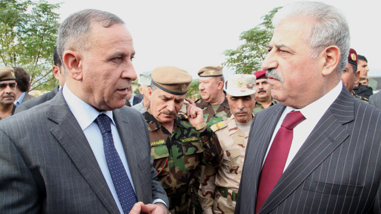 Iraqi defence minister Khaled al-Obeidi talks with Mosul governor Atheel al-Nujaifi during visit at a training camp for Kurdish Peshmerga troops in Arbil Iraqi defence minister Khaled al-Obeidi (L) talks with Mosul governor Atheel al-Nujaifi during a visit at a training camp for Kurdish Peshmerga troops in Arbil, November 3, 2014. REUTERS/Azad Lashkari (IRAQ - Tags: CIVIL UNREST POLITICS MILITARY) - RTR4COAN