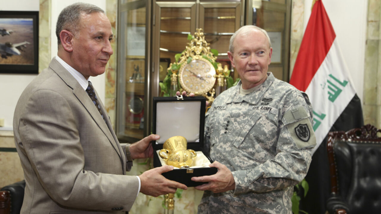 MIDEAST-CRISIS/IRAQ-USA Iraq's Defence Minister Khaled al-Obeidi (L) meets with U.S. Army General Martin Dempsey, chairman of the Joint Chiefs of Staff, at the defence ministry in Baghdad November 15, 2014. Dempsey arrived on Saturday in Baghdad on an unannounced visit to meet U.S. commanders preparing to increase American assistance to Iraqi and Kurdish forces battling Sunni Islamic State (IS) militants. REUTERS/Stringer (IRAQ - Tags: POLITICS MILITARY CIVIL UNREST CONFLICT) - RTR4E991
