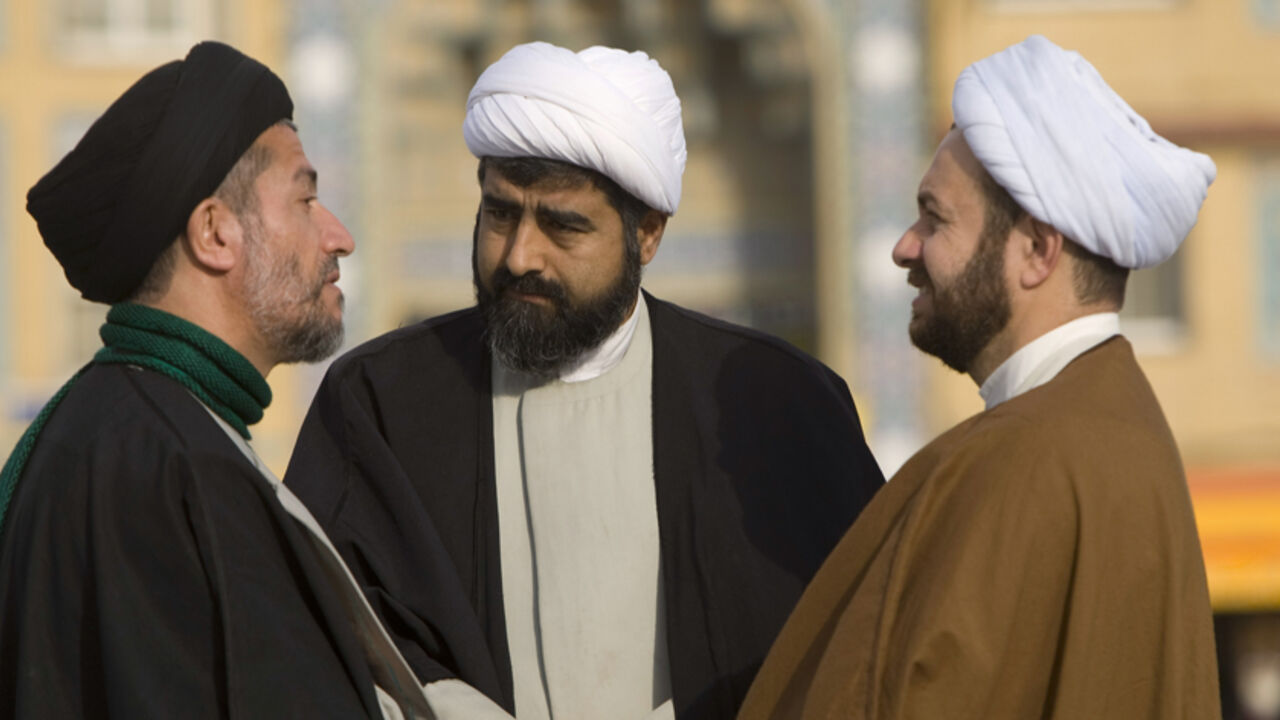 IRAN/ Clerics speak on the campus of the Seminary in Qom, 120 km (75 miles) south of Tehran February 3, 2009. REUTERS/Caren Firouz (IRAN) - RTXB72L