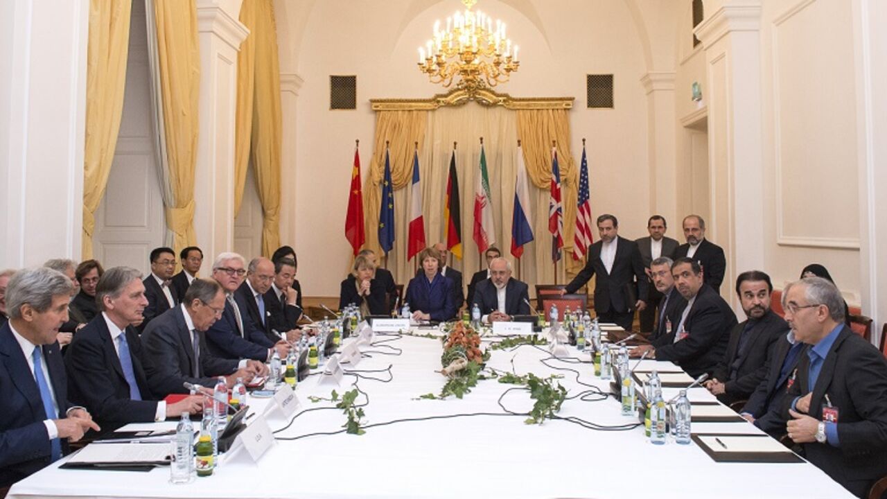 AUSTRIA-IRAN-NUCLEAR-POLITICS-EXTENSION Delegations of US Secretary of State John Kerry, Britain's Foreign Secretary Philip Hammondm, Russian Foreign Minister Sergei Lavrov, Iranian Foreign Minister Mohammad Javad Zarif,German Foreign Minister Frank-Walter Steinmeier, French Foreign Minister Laurent Fabius, European Union High Representative Catherine Ashton, Chinese Foreign Minister Wang Yi sit around the negotiations table during their meeting in Vienna on November 24, 2014. Iran and world powers looked likely Monday to miss a midnight deadlin
