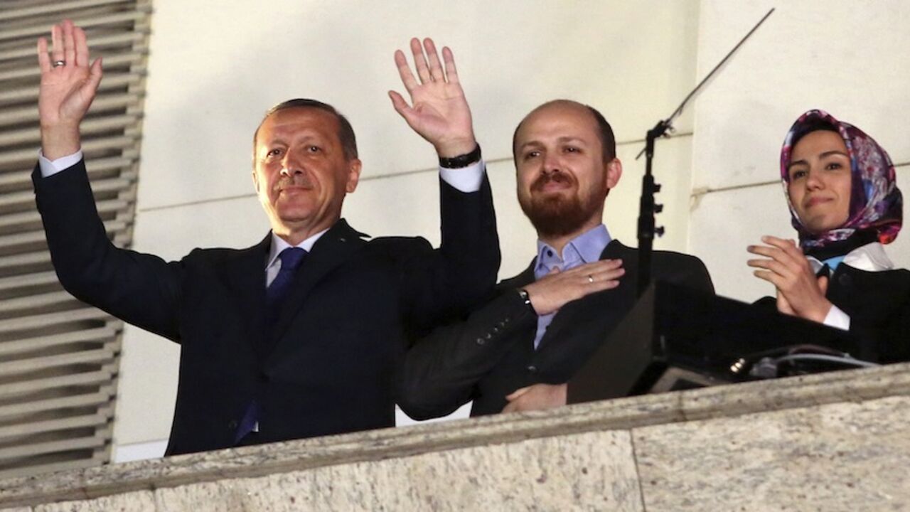Turkish Prime Minister Tayyip Erdogan, accompanied by his son Bilal and daughter Sumeyye, greets his supporters in Ankara Turkish Prime Minister Tayyip Erdogan (L), accompanied by his son Bilal and daughter Sumeyye, greets his supporters at the AK Party headquarters in Ankara March 30, 2014. Tayyip Erdogan declared victory in local polls that had become a referendum on his rule and said he would "enter the lair" of enemies who have accused him of corruption and leaked state secrets. "They will pay for this," he said. Erdogan spoke from a balcony at his AK Party headquarters to thousands of cheering supporters as early results