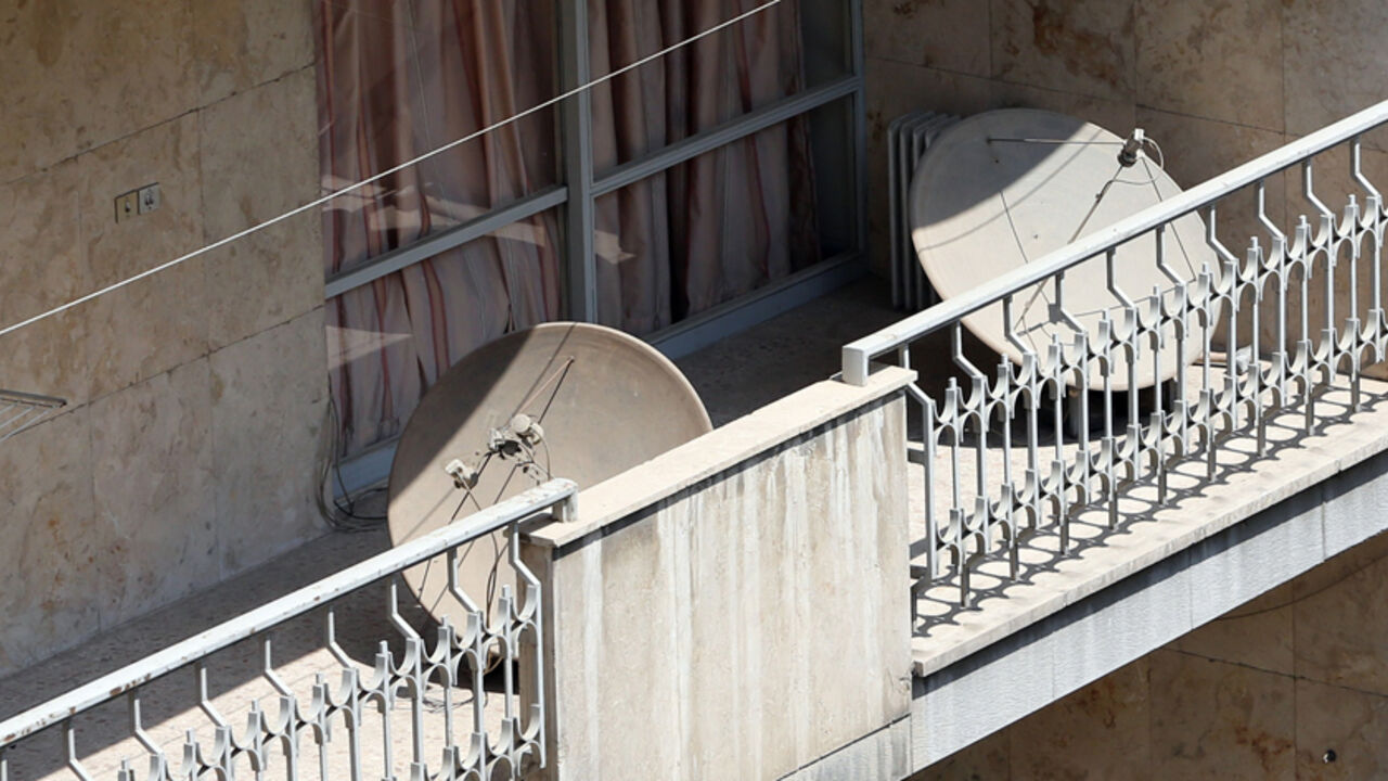 Nic6365571 A general view taken on August 27, 2014 shows satellite dishes on balconies in northern Tehran. A new campaign has been launched by Iranian police to seize satellite dishes which are banned in Iran, the official IRNA news agency said. AFP PHOTO/ATTA KENARE (Photo credit should read ATTA KENARE/AFP/Getty Images)