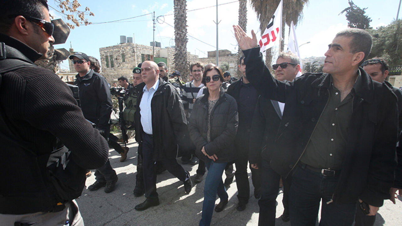 Nic6300710 Israeli Meretz party members Nitzan Horowitz (2nd from R), Zehava Galon (C) and Issawi Frej (c-L) take part in a visit of the "Al-Shuhada" street in the West Bank city of Hebron on February 25, 2014 in support of Palestinians who were forced out of the old quarter at the outset of the second Palestinian intifada by the Israeli army to allow for Jewish settlers to move securely in the area. Today also marks the 20th anniversary of the massacre of 29 Palestinian Muslim worshipers by Jewish extremist Baruch Go