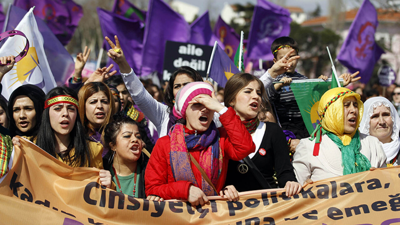 TURKEY/ Women walk as they shout slogans during a rally calling for gender equality, two days after International Women's Day, in Istanbul March 10, 2013. REUTERS/Osman Orsal (TURKEY - Tags: POLITICS CIVIL UNREST) - RTR3ET3V