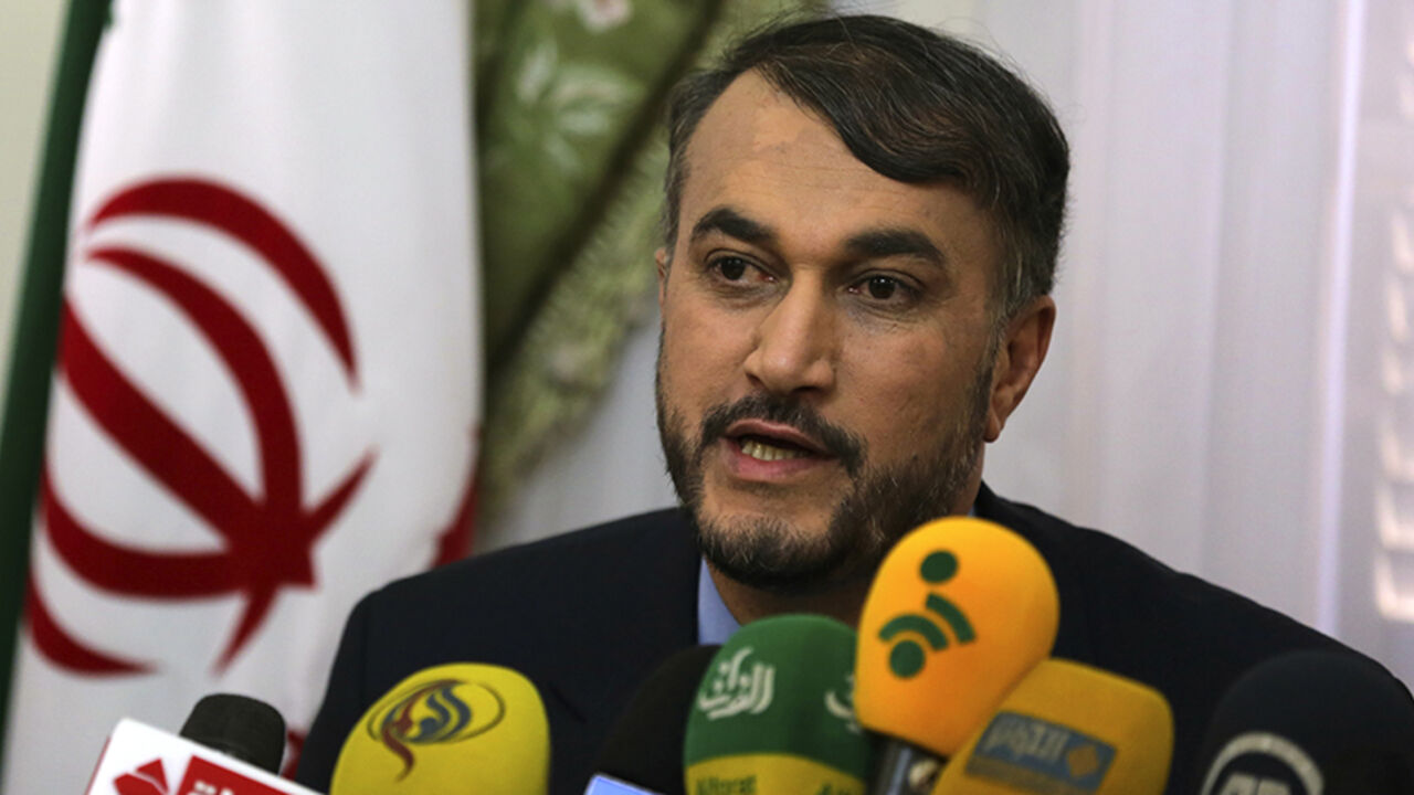 EGYPT/ Hossein Amir-Abdollahian, Iran's envoy to the Organisation of Islamic Cooperation (OIC), speaks during a news conference about the new political relations between Iran and Egypt after the newly elected Egyptian President Abdel Fattah al-Sissi was sworn in, at the Iranian embassy in Cairo June 9, 2014. REUTERS/Mohamed Abd El Ghany (EGYPT - Tags: POLITICS) - RTR3SWSY