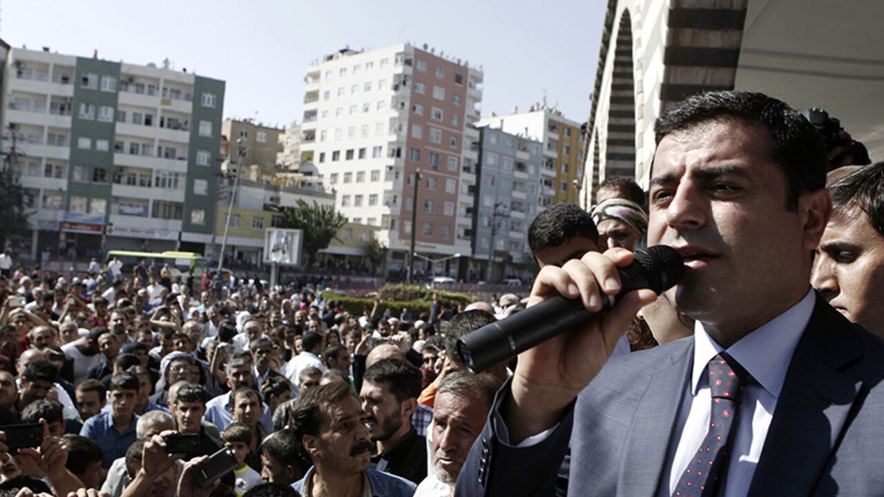 MIDEAST-CRISIS/ Selahattin Demirtas, co-chair of the HDP, Turkey's leading Kurdish party, addresses his supporters in Diyarbakir October 9, 2014. Islamic State fighters launched a renewed assault on the Syrian city of Kobani on Wednesday night, and at least 21 people were killed in riots in neighbouring Turkey where Kurds rose up against the government for doing nothing to protect their win. REUTERS/Osman Orsal (TURKEY - Tags: POLITICS CIVIL UNREST) - RTR49I8X