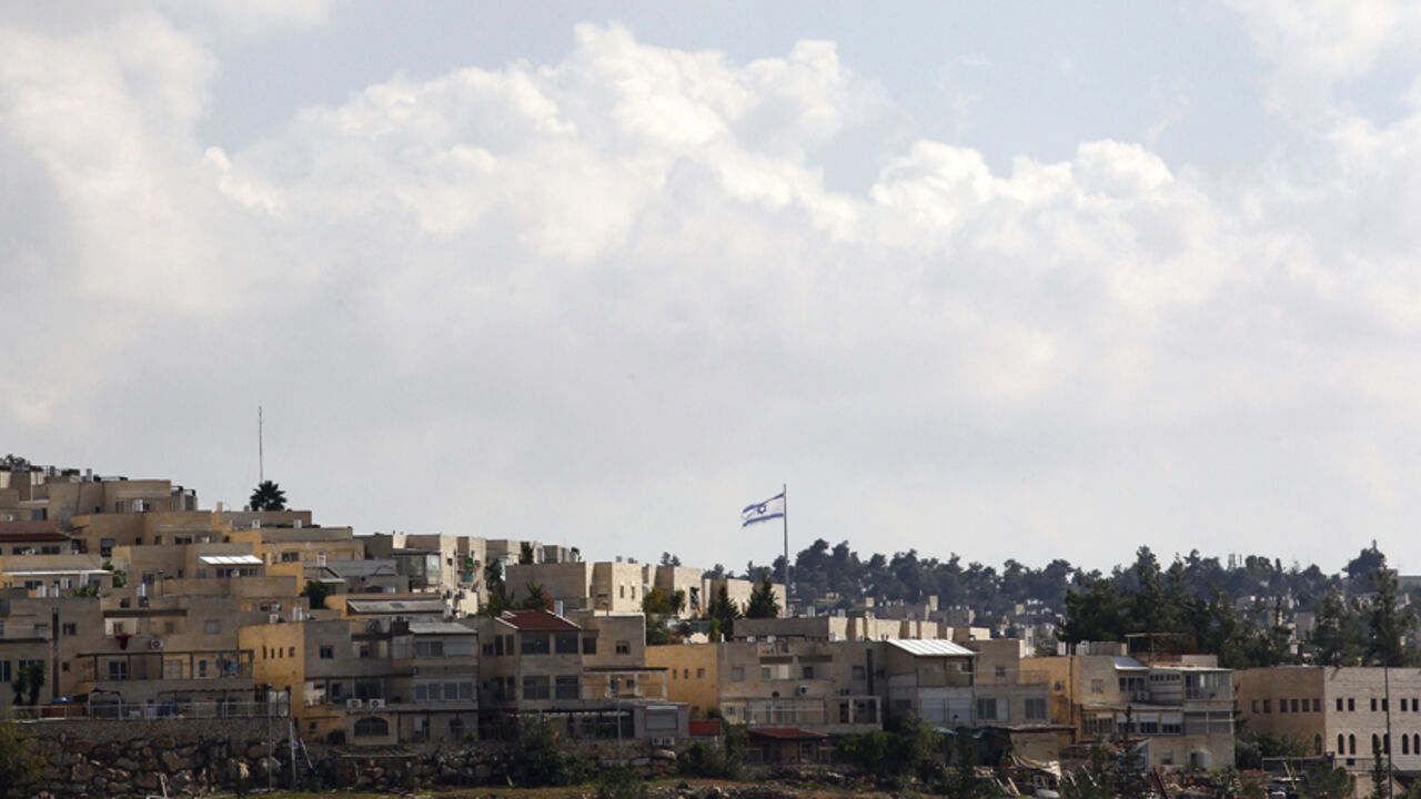 MIDEAST-SETTLEMENT/ Israel's national flag flutters in the settlement of Ramat Shlomo November 4, 2014. An Israeli government committee on Monday advanced plans for 500 settler homes in East Jerusalem, an official said, in the face of disapproval from the United States at construction on occupied Palestinian land. The Interior Ministry panel's preliminary approval of the new homes for Ramat Shlomo, a neighbourhood built on West Bank territory captured in the 1967 war and annexed to Jerusalem in a move not recognised abroad, wa