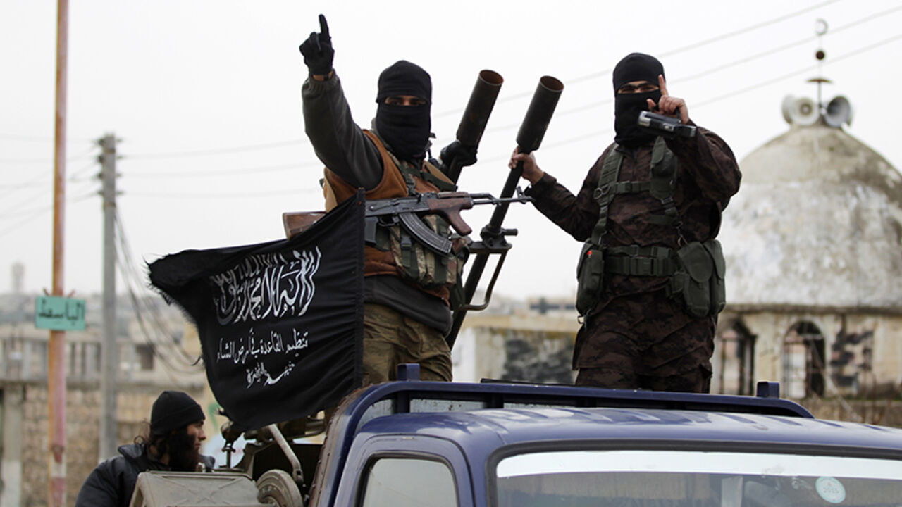 SYRIA-CRISIS/ Members of al Qaeda's Nusra Front gesture as they drive in a convoy touring villages, which they said they have seized control of from Syrian rebel factions, in the southern countryside of Idlib, December 2, 2014. Picture taken December 2, 2014.
REUTERS/Khalil Ashawi (SYRIA - Tags: CIVIL UNREST CONFLICT) - RTR4GJ39