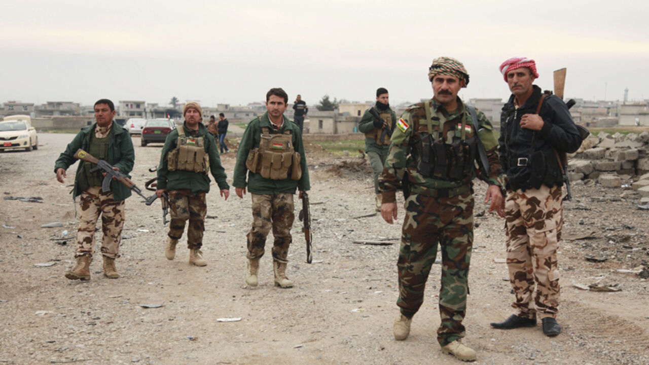 MIDEAST-CRISIS/SINJAR Members of the Kurdish security forces take part in a patrol in Zumar, Nineveh province December 18, 2014. Kurdish peshmerga fighters have fought their way to Iraq's Sinjar mountain and freed hundreds of people trapped there by Islamic State fighters, a Kurdish leader said on Thursday. Kurdish peshmerga soldiers began their offensive on Wednesday to break the jihadists' siege of the mountain and the town of Sinjar. The peshmerga advanced from Zumar, east of Sinjar, capturing back 700 square km (270 square m