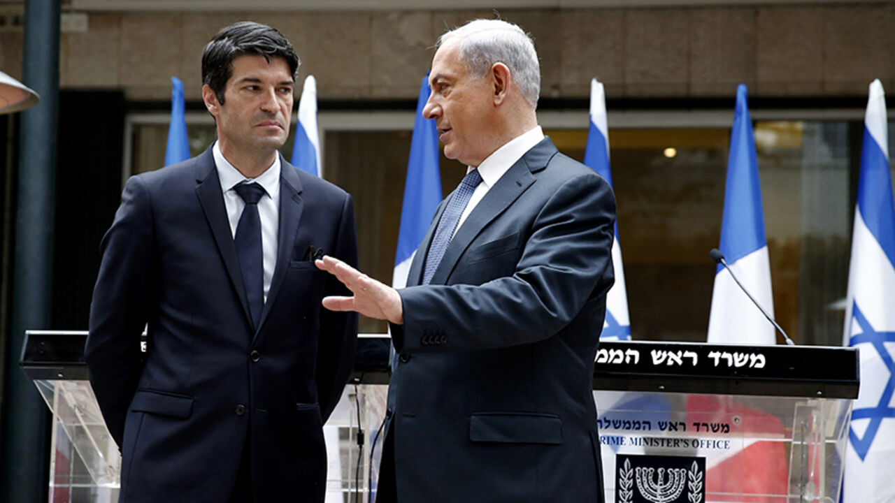 FRANCE-SHOOTING/ Israeli Prime Minister Benjamin Netanyahu (R) talks with French Ambassador to Israel Patrick Maisonnave after presenting his condolences, following a shooting by gunmen at the offices of weekly satirical magazine Charlie Hebdo in Paris, at Netanyahu's residence in Jerusalem January 9, 2015. The two main suspects in the Charlie Hebdo killings were sighted on Friday in the northern French town of Dammartin-en-Goele where at least one person had been taken hostage, a police source said. REUTERS/Thomas Coex/Poo