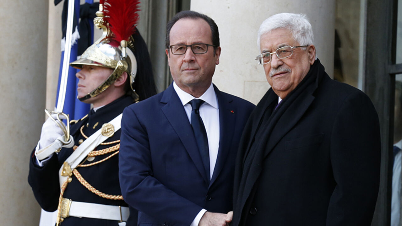 FRANCE-SHOOTING/ French President Francois Hollande (L) welcomes Palestinian President Mahmoud Abbas (R) at the Elysee Palace before attending a solidarity march (Marche Republicaine) in the streets of Paris January 11, 2015. Hundreds of thousands of French citizens will be joined by dozens of foreign leaders, among them Arab and Muslim representatives, in a march on Sunday in an unprecedented tribute to this week's victims following the shootings by gunmen at the offices of the satirical weekly newspaper Charlie Hebdo, the