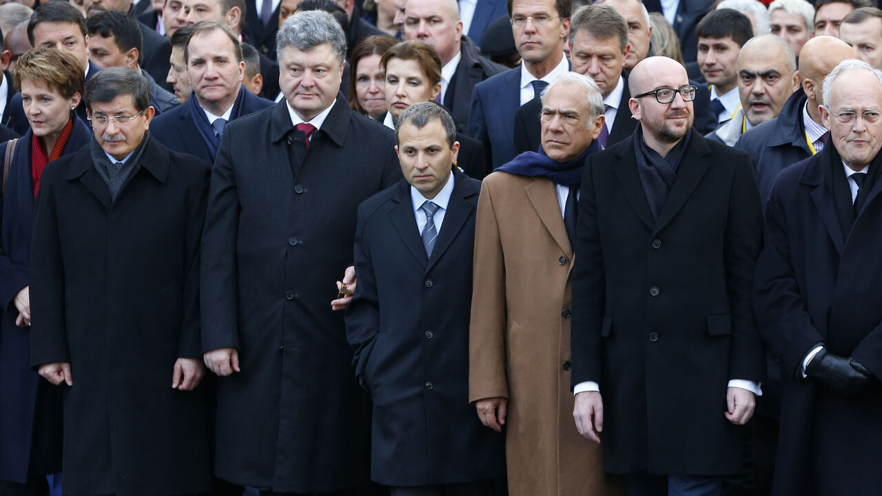 FRANCE-SHOOTING/ Switzerland's President Simonetta Sommaruga (L), Turkey's Prime Minister Ahmet Davutoglu (2ndL), Ukraine's President Petro Poroshenko (3rdL), Organization for Economic Co-operation and Development (OECD) Secretary-General Angel Gurria (3rdR), Belgian Prime Minister Charles Michel (2ndR) take part with dozens of foreign leaders in a solidarity march (Marche Republicaine) in the streets of Paris January 11, 2015. Hundreds of thousands of French citizens will be joined by dozens of foreign leaders, among them