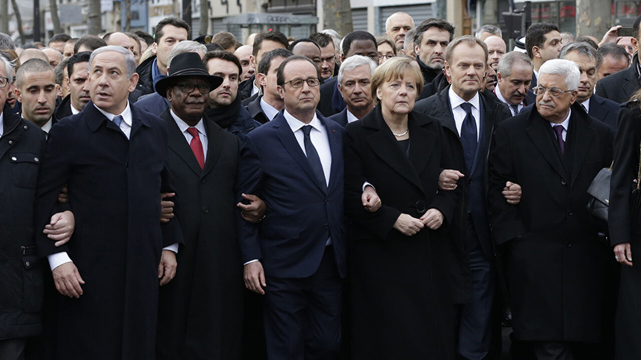 FRANCE-SHOOTING/ French President Francois Hollande is surrounded by Heads of state including (LtoR) Israel's Prime Minister Benjamin Netanyahu, Mali's President Ibrahim Boubacar Keita, Germany's Chancellor Angela Merkel, European Council President Donald Tusk and Palestinian President Mahmoud Abbas as they attend the solidarity march (Marche Republicaine) in the streets of Paris January 11, 2015. French citizens will be joined by dozens of foreign leaders, among them Arab and Muslim representatives, in a march on Sunday in