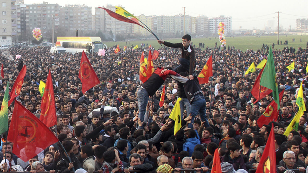 MIDEAST-CRISIS/SYRIA-KURDS People gather to celebrate in the Kurdish-dominated city of Diyarbakir in southeastern Turkey, after Kurdish forces said they took full control of the Syrian town of Kobani, January 27, 2015. Kurdish forces battled Islamic State fighters outside Kobani on Tuesday, a monitoring group said, a day after Kurds said they took full control of the northern Syrian town following a four-month battle. REUTERS/Sertac Kayar (TURKEY - Tags: POLITICS CIVIL UNREST CONFLICT) - RTR4N6SW