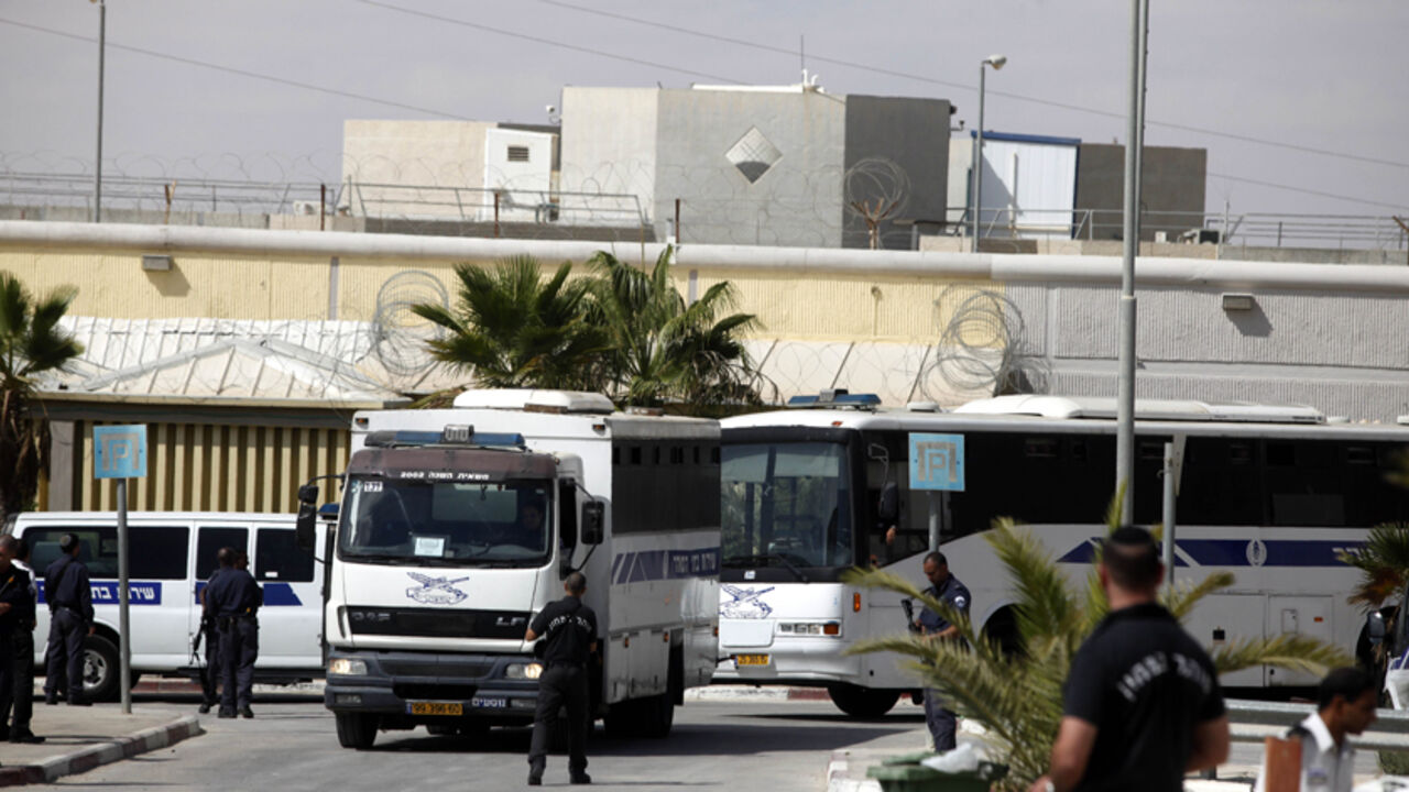 66877729 MITZPE RAMON, ISRAEL - OCTOBER 16: (ISRAEL OUT) Israeli Prison Service bus carrying Palestinians prisoners leaves Nafha prison on October 16, 2011. in Mitzpe Ramon, Israel. IDF soldier Gilad Shalit is to be freed from 5 years of captivity in Gaza in an exchange deal which will see the release of 477 Palestinian prisoners in an initial deal with another 550 to freed after the return of Shalit. (Photo by Lior Mizrahi/Getty Images)