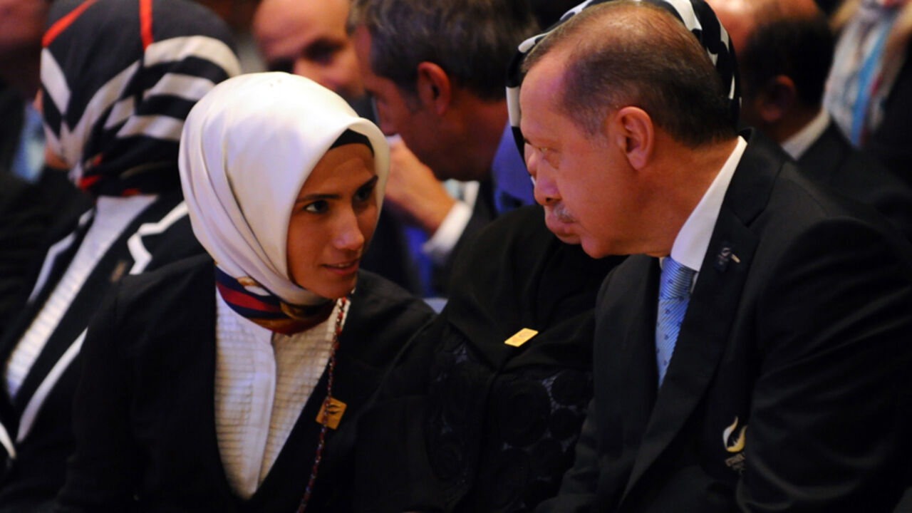 APM447869 Prime Minister of Turkey, Recep Tayyip Erdogan (R) speaks with her daughter Sumeyye Erdogan, during the 125th Session of the International Olympic Committee (IOC), in Buenos Aires, on September 7, 2013. The host of the 2020 Olympic Games will be contested between Tokyo and Istanbul in a second round of voting after Madrid was eliminated in dramatic fashion from the race after the first round of voting by International Olympic Committee (IOC) members. AFP PHOTO / DANIEL GARCIA (Photo credit should re