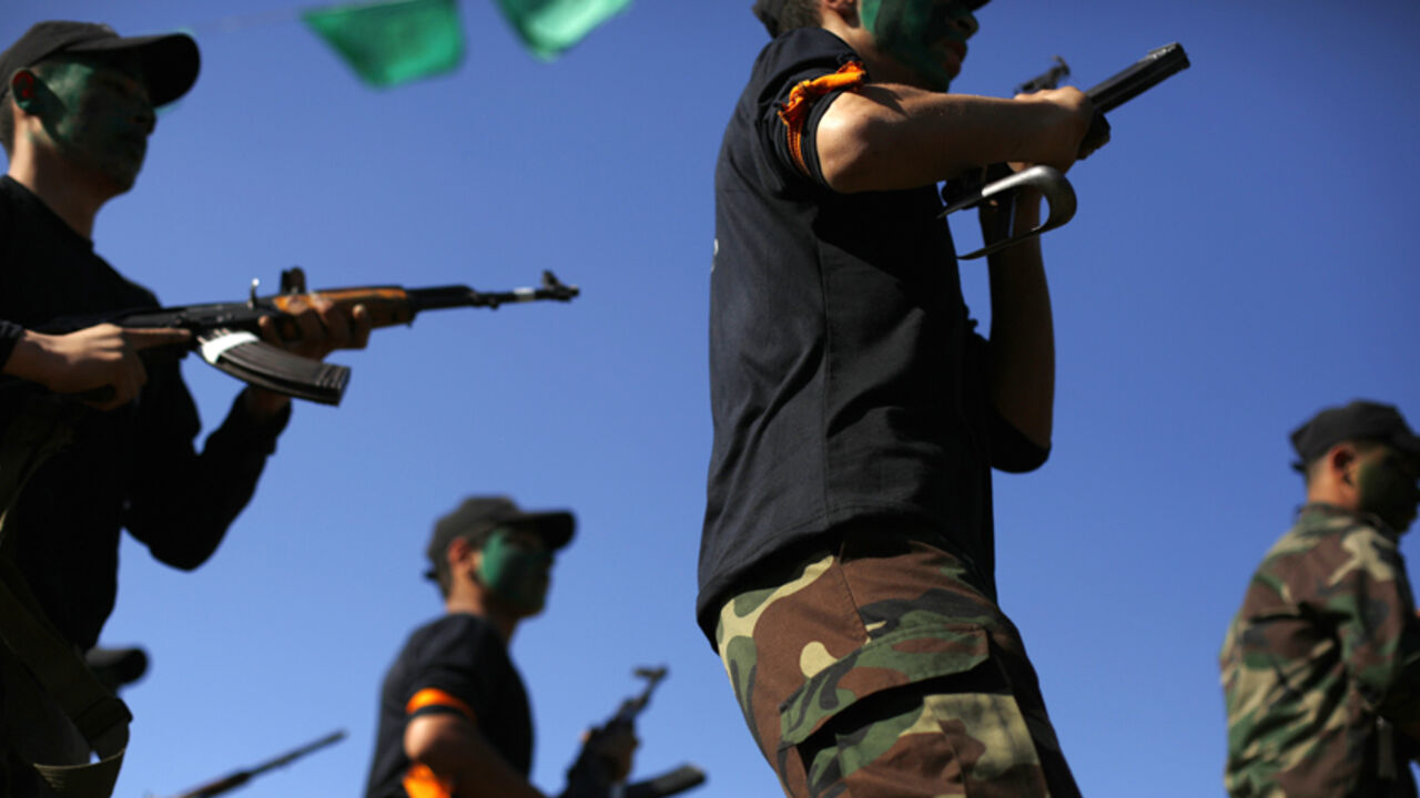 Nic6411974 Palestinian youth take part in military exercises during a graduation ceremony as part of a training camp run by the Hamas movement on January 29, 2015 in Gaza City. AFP PHOTO / MOHAMMED ABED (Photo credit should read MOHAMMED ABED/AFP/Getty Images)
