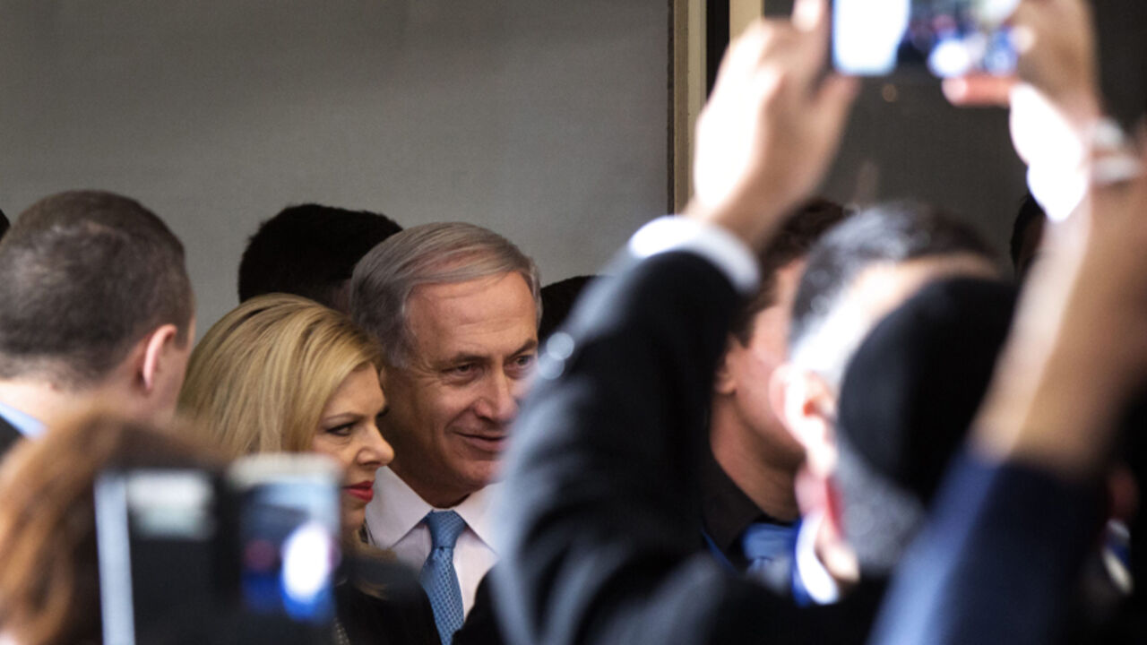 Nic6415025 Israeli Prime Minister and Likud party leader Benjamin Netanyahu and his wife Sara arrive at an election campaign meeting with members of Israel's French Jewish community, at a Jerusalem hotel on February 8, 2015, ahead of the March 17 general elections. AFP PHOTO/MENAHEM KAHANA (Photo credit should read MENAHEM KAHANA/AFP/Getty Images)