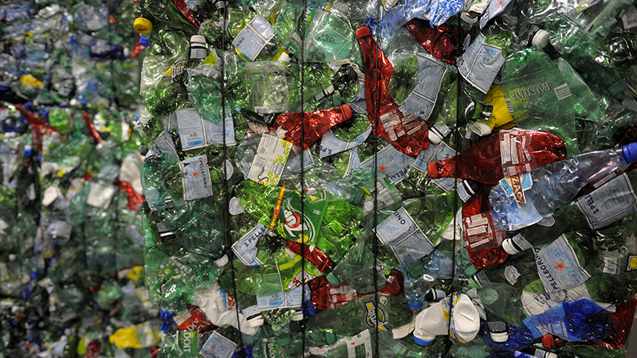 FRANCE/ Crushed plastic bottles are seen at a recycling centre in Paris May 4, 2011. The recycling centre, which is the first one in Paris, has a capacity to treat around 15000 tons of wastes per year. REUTERS/Philippe Wojazer (FRANCE - Tags: SOCIETY BUSINESS ENVIRONMENT) - RTR2LZ8C