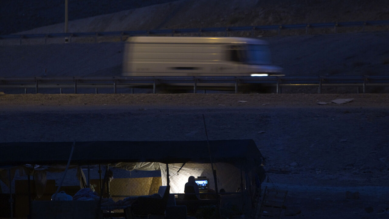 Bedouins of the Jahalin tribe watch television at their encampment, al-Khan al-Ahmar Bedouins of the Jahalin tribe watch television at their encampment, al-Khan al-Ahmar, in the Judean desert close to the road between Jericho and Jerusalem June 16, 2012. Bedouin tents and wandering goats dot the barren hills on the drive from Jerusalem down to the Dead Sea. But the Bedouin tradition is slowly dying out as Israel clears the camps to make way for expanding Jewish urban settlements. Picture taken June 16, 2012. To match Feature PALESTINIANS-ISRAEL/BEDOUIN .REUTERS/Darren Whiteside (WEST BANK -