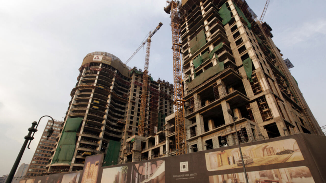 EGYPT-INVESTMENT/ A new hotel, being built by the Qatari Diar company as part of its investment in Egypt, stands near Kornish El Nile in Cairo September 30, 2012. A trickle of foreign donor aid looks like Egypt's best hope of averting a balance of payments crisis for now because many of the investors who fled the country last year are loath to return until the government seals a loan from the IMF. A deal with the International Monetary Fund would lend vital credibility to a new Islamist-led administration desperate to revive