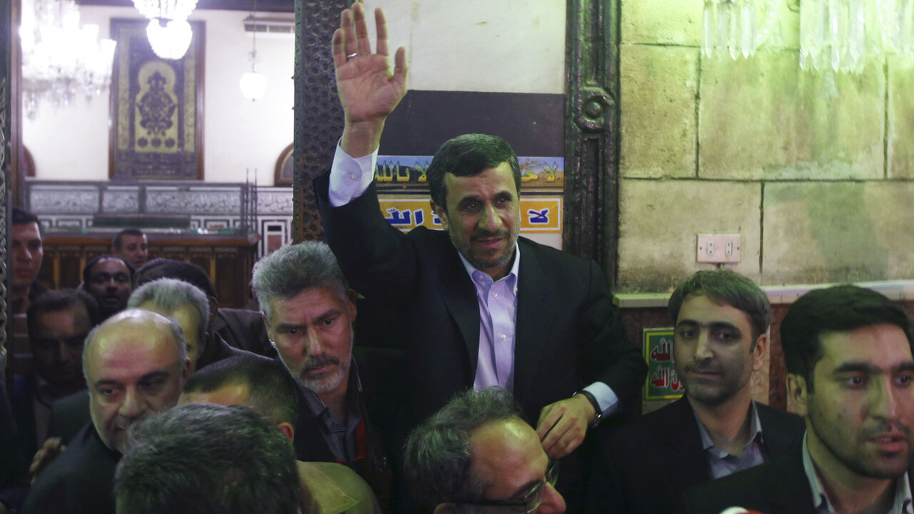 EGYPT-IRAN/ Iran's President Mahmoud Ahmadinejad (C) waves near the shrine (L) of Prophet Mohammed's grandson Hussein ibn Ali at the Al-Hussein mosque, named after the grandson, in old Cairo February 5, 2013. Ahmadinejad was both kissed and scolded on Tuesday when he began the first visit to Egypt by an Iranian president since Tehran's 1979 Islamic revolution. The trip was meant to underline a thaw in relations since Egyptians elected an Islamist head of state, President Mohamed Mursi, last June. But it also highlighte