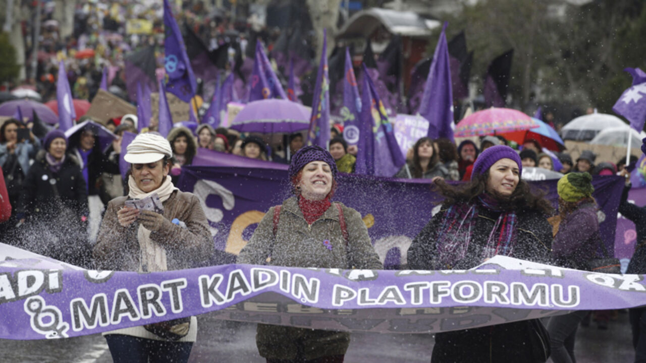People hold a banner as they protest against the government and violence against women, a day after International Women's Day in Istanbul March 9, 2014. On March 8 activists around the globe celebrate International Women's Day, which dates back to the beginning of the 20th Century and has been observed by the United Nations since 1975. The UN writes that it is an occasion to commemorate achievements in women's rights and to call for further change. The banner reads, "8 march women unions". REUTERS/Osman Ors